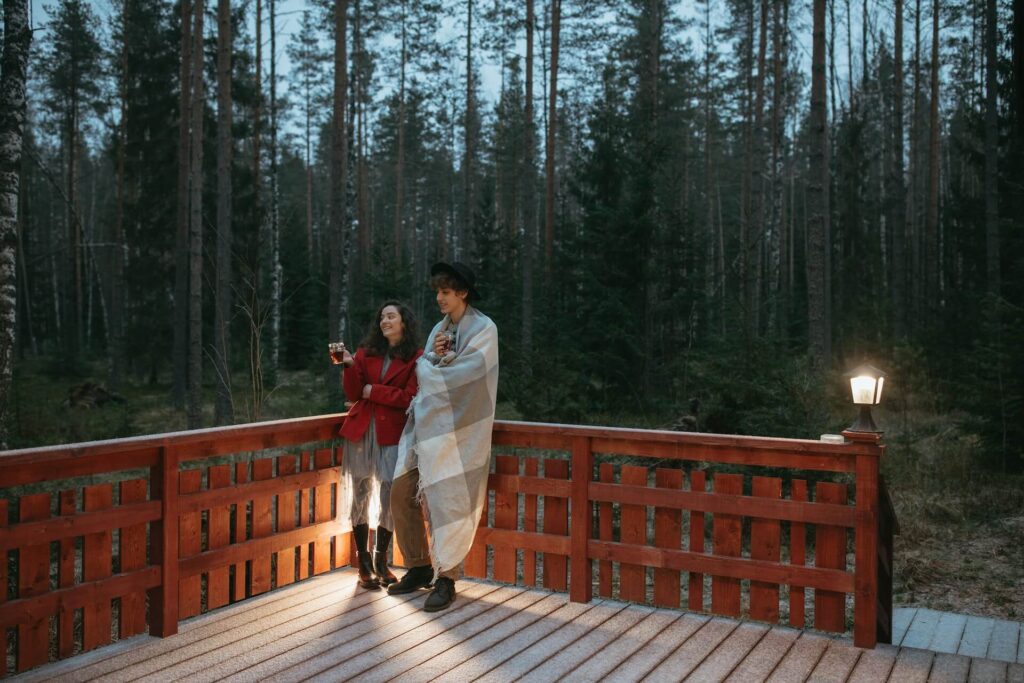 man and woman enjoy time on the deck